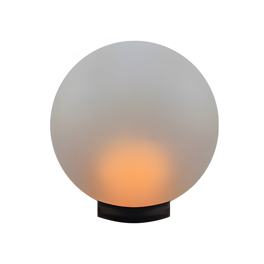 Silver Metal Table Lamp large round landscape light with soft orange glow creating dramatic focal point in outdoor lighting design