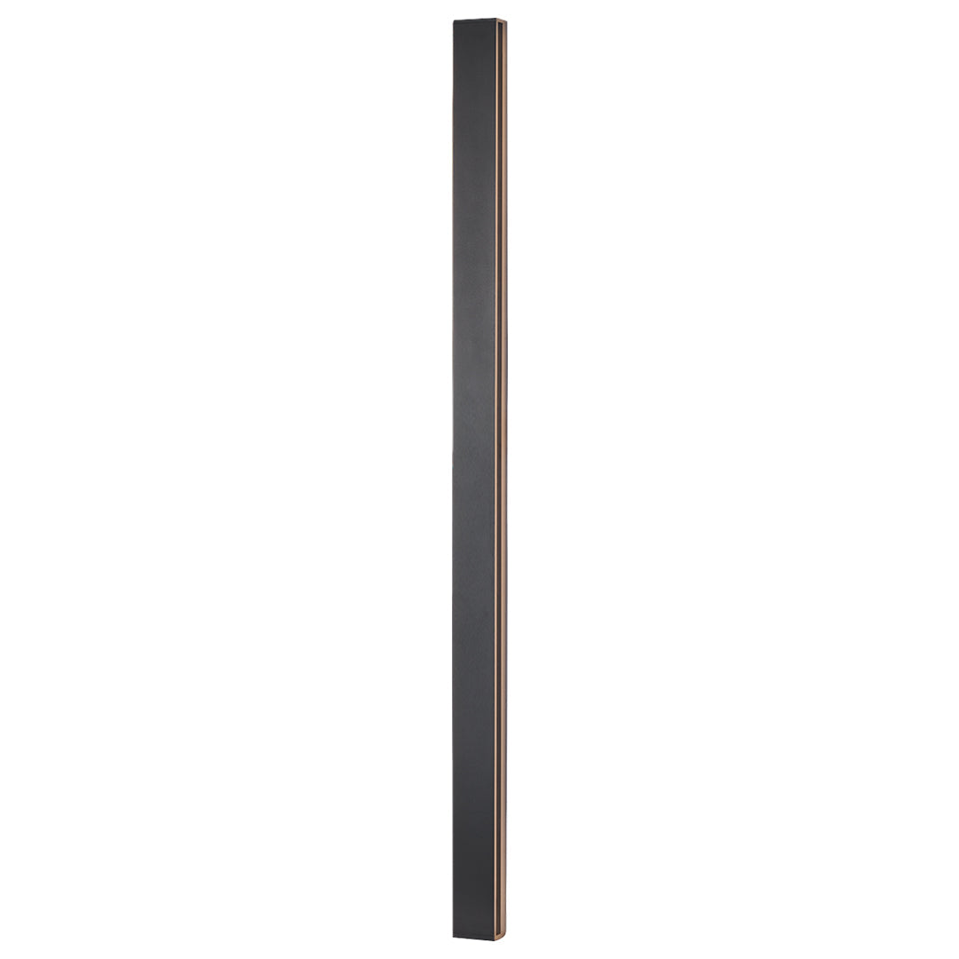 Large wall mounted linear light illuminating minimalist entryway with wood credenza and decorative vase