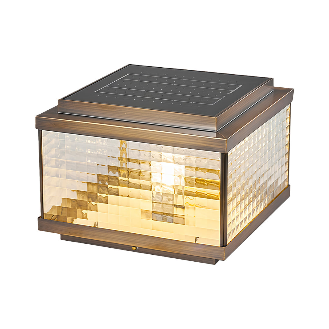 Square pillar cap light with layered horizontal glass design creating warm ambient outdoor illumination.