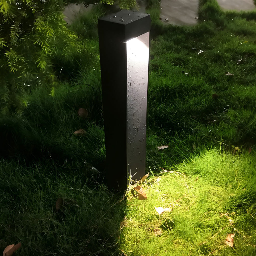 LED bollard light installed beside a driveway edge for safe outdoor navigation.
