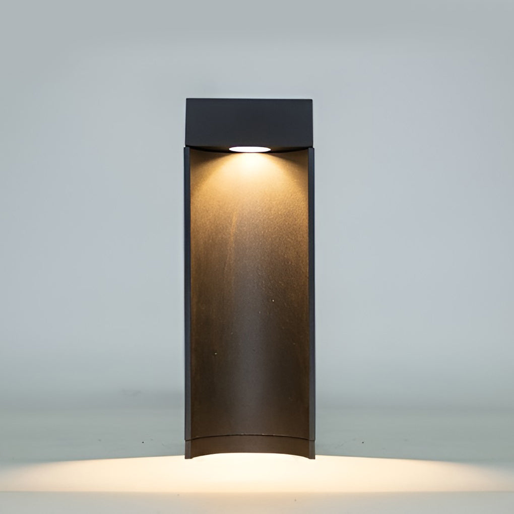 LED bollard light installed along pathway providing subtle outdoor accent lighting.
