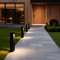 LED bollard lights lining a modern residential walkway providing soft pathway illumination.