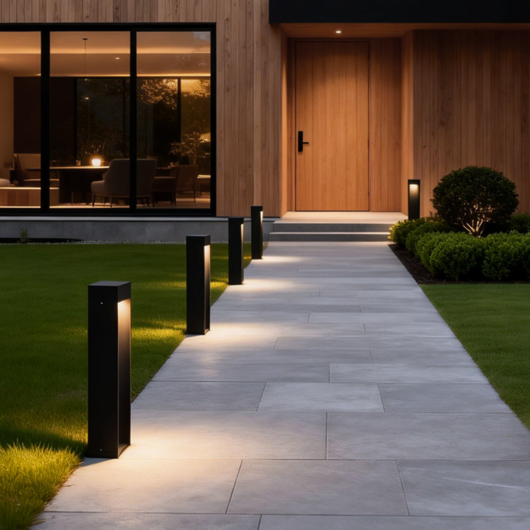 LED bollard lights lining a modern residential walkway providing soft pathway illumination.