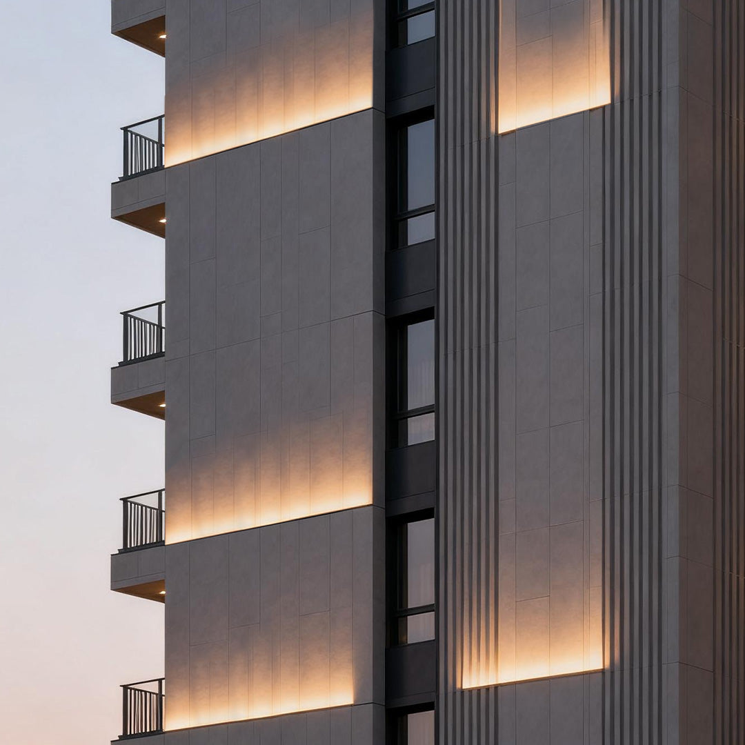 LED building facade lighting accentuating the edges of a contemporary building with warm linear light strips.