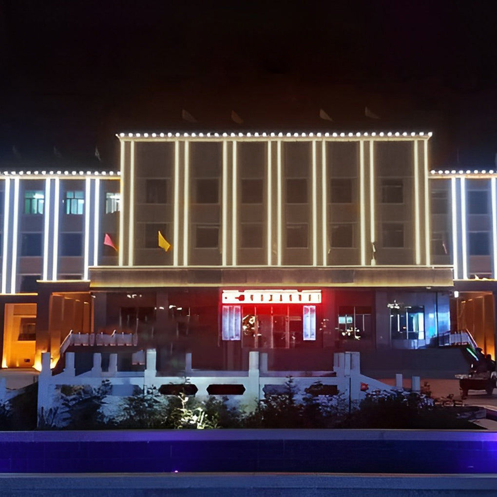 LED building facade lighting outlining a modern building with linear lights for dynamic urban architecture.
