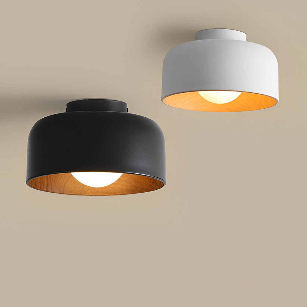 LED ceiling light with wood grain finish, providing soft illumination in a cozy living area.