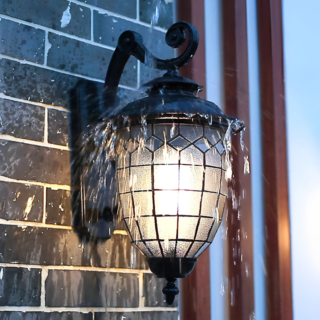 LED outdoor sconce operating in rainy weather demonstrating waterproof performance.