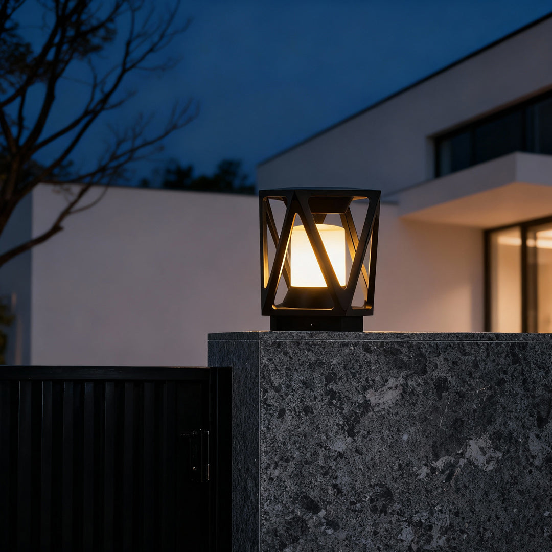 Led pillar light placed on a stone column near a home entrance, creating warm and inviting nighttime illumination.
