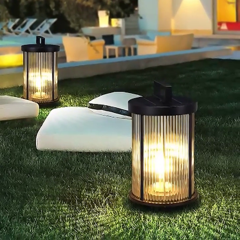 LED solar lanterns outdoor with a cylindrical design, illuminating a garden area with soft, warm light.