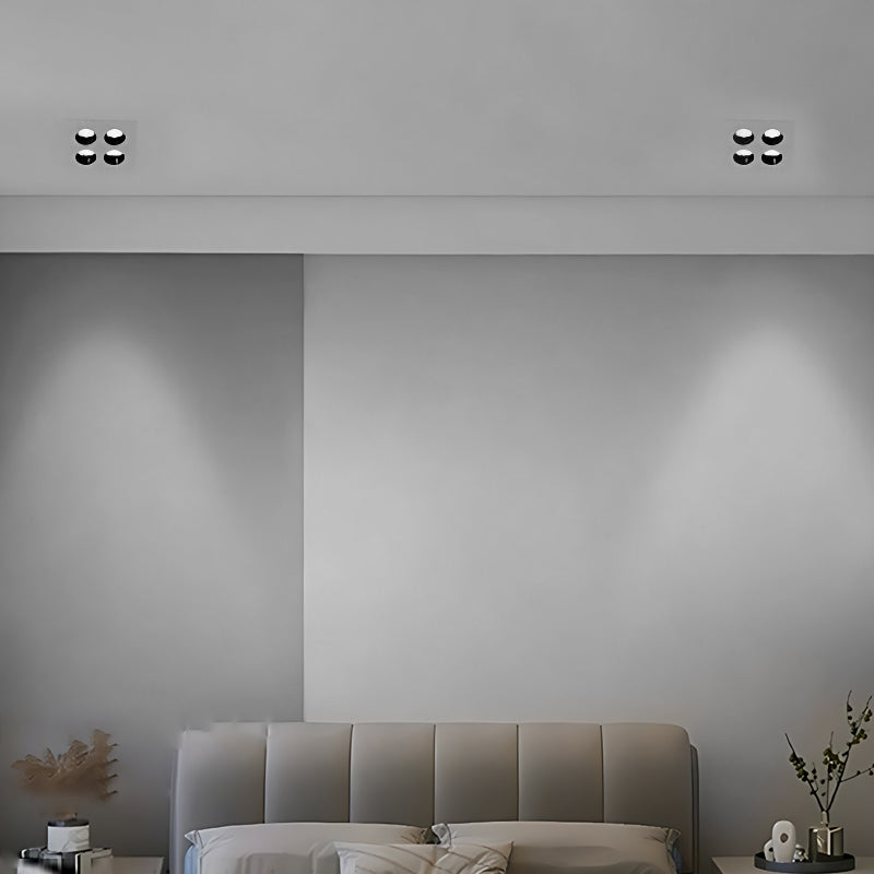 LED spotlights bulbs casting light on a minimalist kitchen countertop.