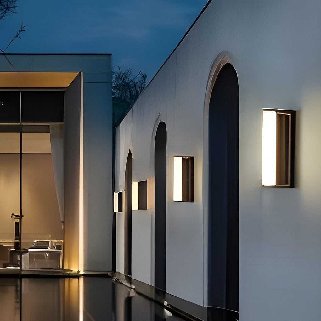 LED wall solar light mounted in a hallway, casting soft light along arched walls.