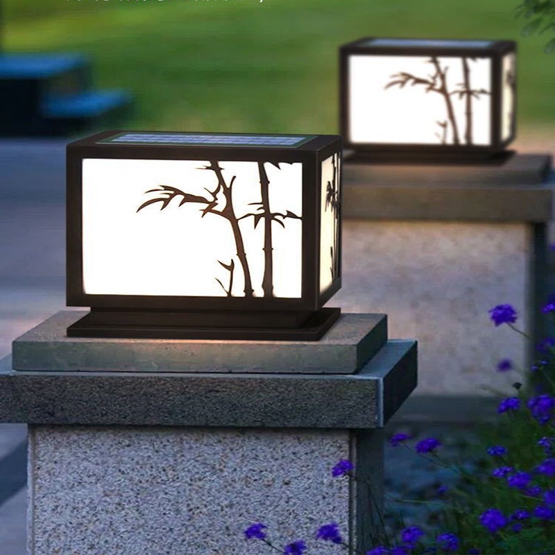 Light box pillar lights with bamboo design, enhancing a minimalist outdoor space.