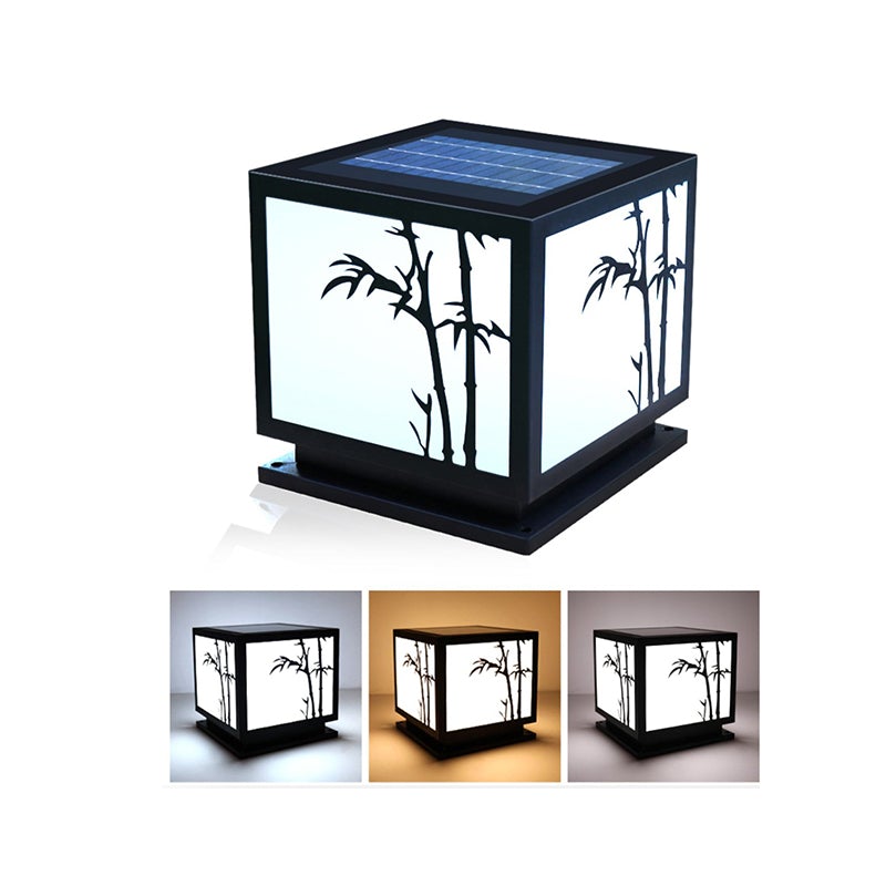Light box pillar lights with bamboo design, illuminating a serene garden pathway.