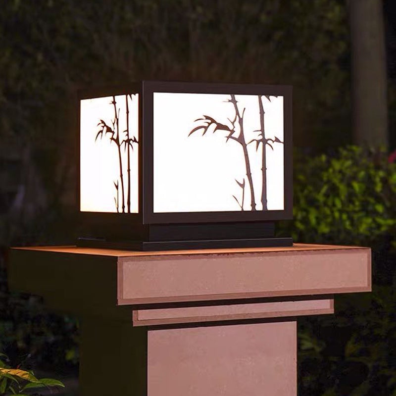 Light box pillar lights with bamboo design, illuminating a stylish outdoor pillar.