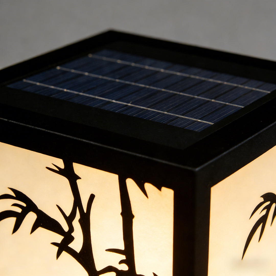 Light box pillar lights providing ambient illumination in a contemporary garden.