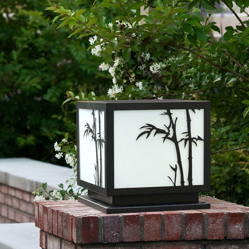 Light box pillar lights enhancing a modern garden with elegant bamboo illumination.