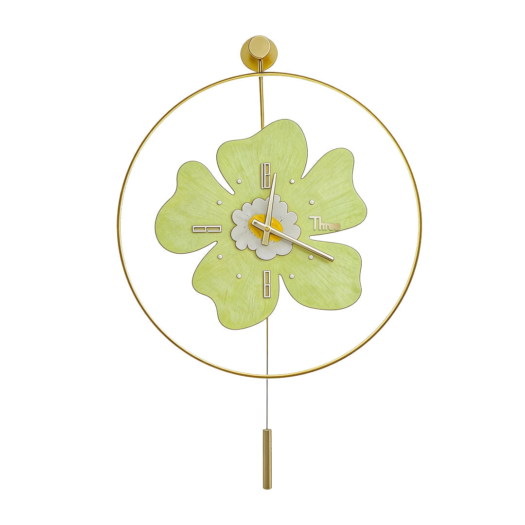 Light green flower shaped wall clock with light featuring a circular gold frame.