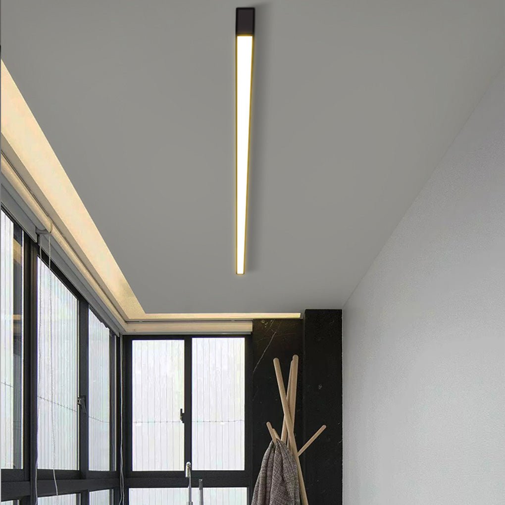 Linear ceiling light installed in modern apartment corridor with soft ambient glow.
