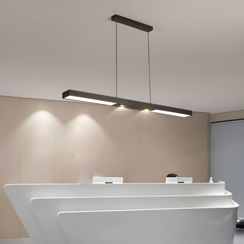 Linear ceiling pendant light installed above modern bathroom vanity