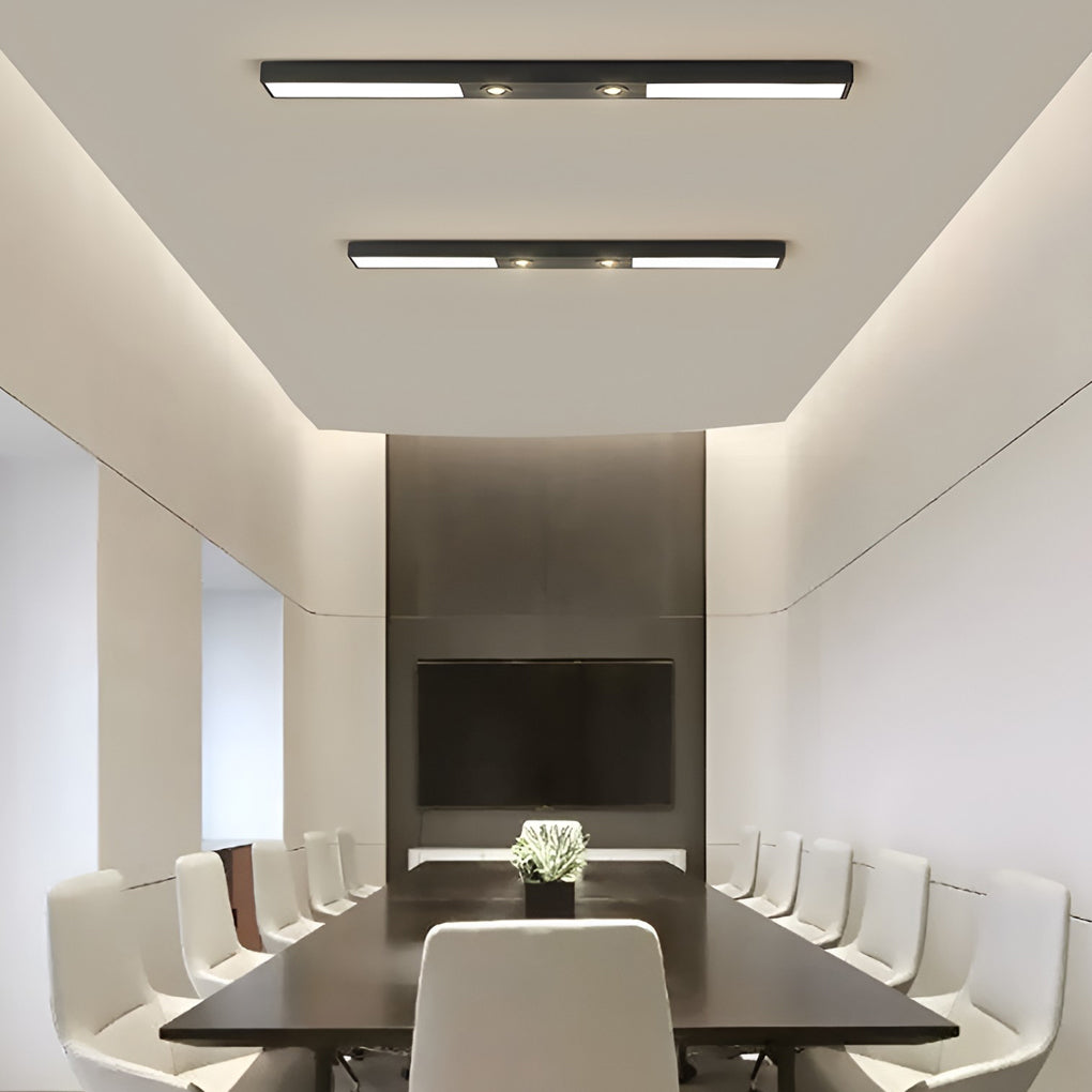 Linear ceiling pendant light illuminating modern conference room
