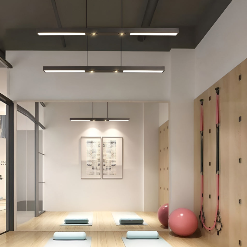 Linear ceiling pendant light installed in commercial corridor