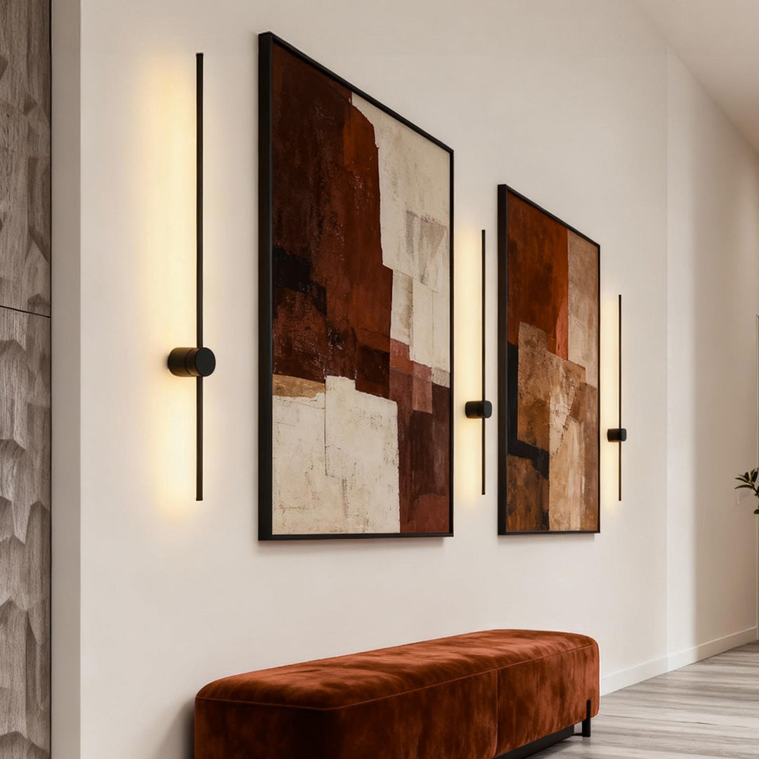 Linear LED wall lights illuminating wall art