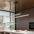 Linear pendant light fixture installed above modern kitchen island.
