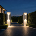 Linear up down wall light mounted beside modern entrance doorway with soft ambient illumination.