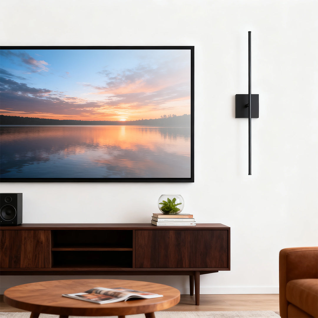 Linear wall lights mounted beside a TV, enhancing the modern aesthetic of a cozy living room.