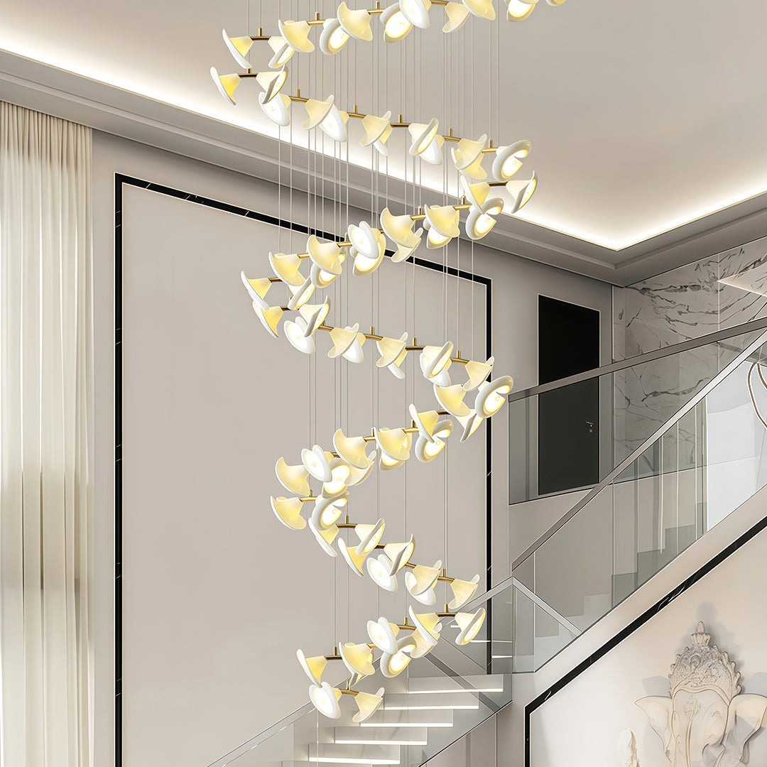 Modern brass ceramic chandeliers hanging in a luxury living room.