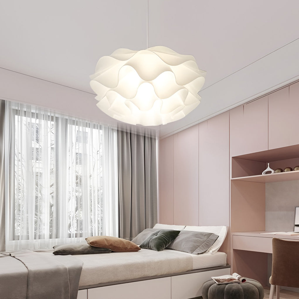 Lotus flower pendant light casting a gentle glow in a stylish indoor setting.