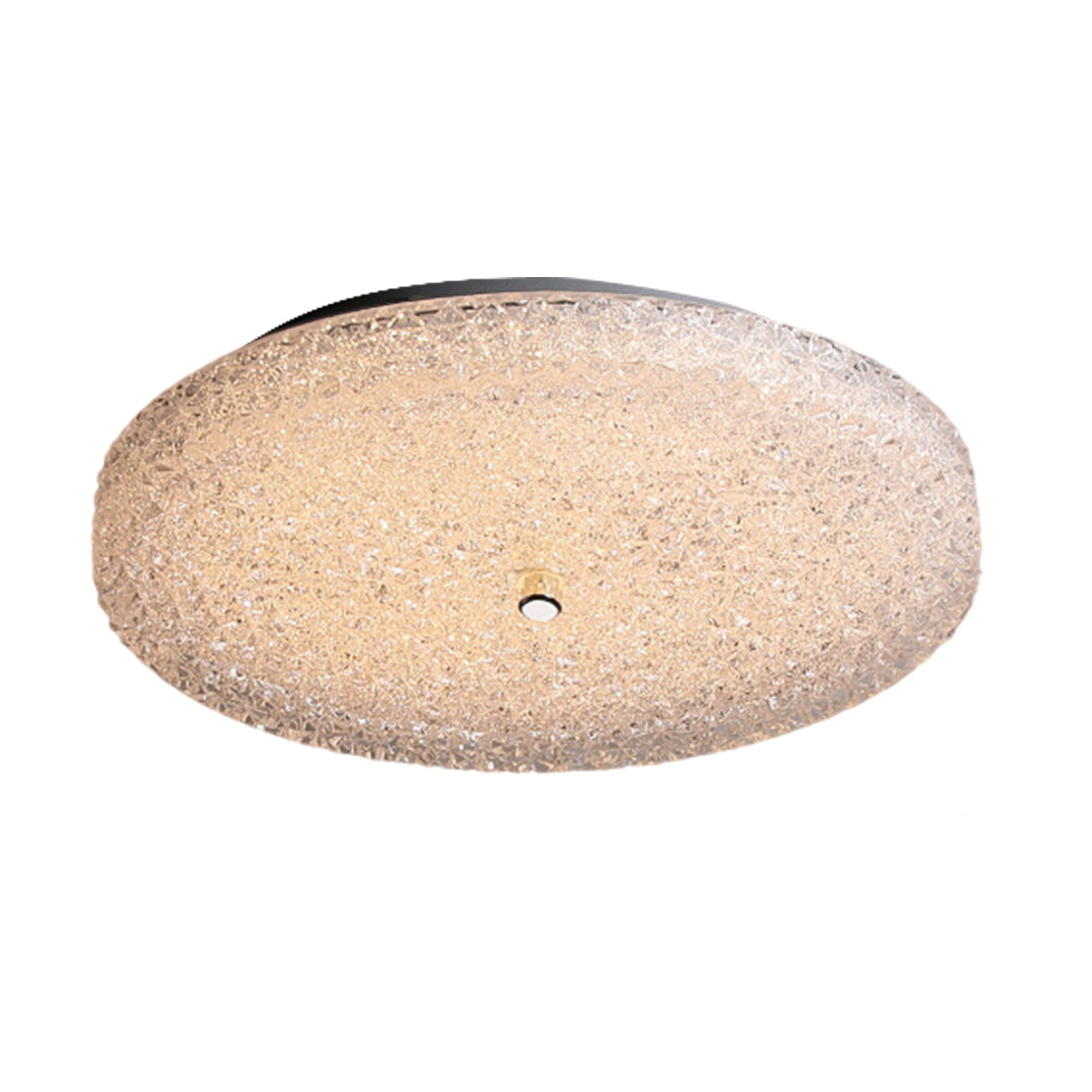 Luxurious flush mount crystal ceiling light on a white backdrop, ideal for modern living rooms.