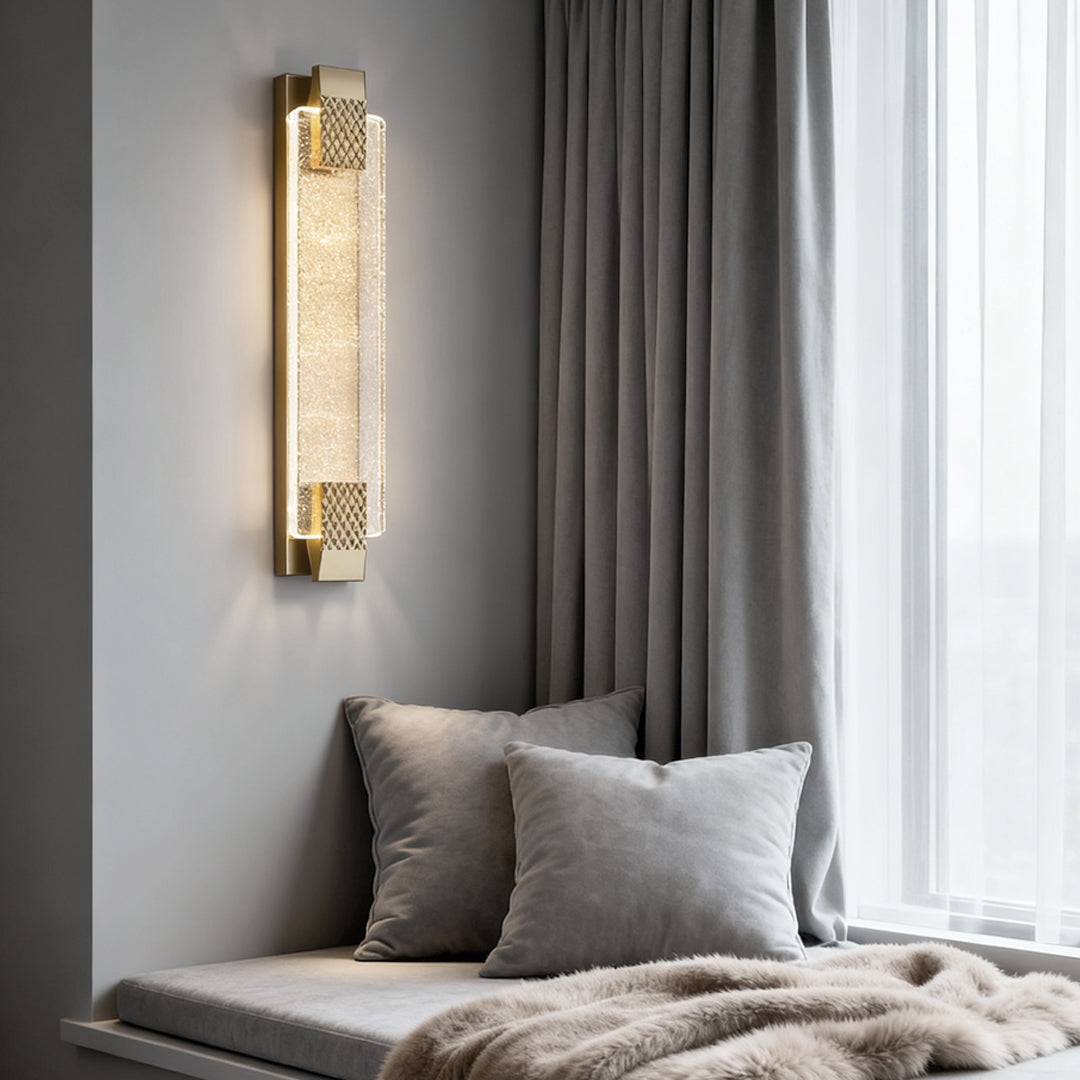 Luxury modern wall lights living room illuminating a cozy living room nook with a sofa and soft throw pillows.