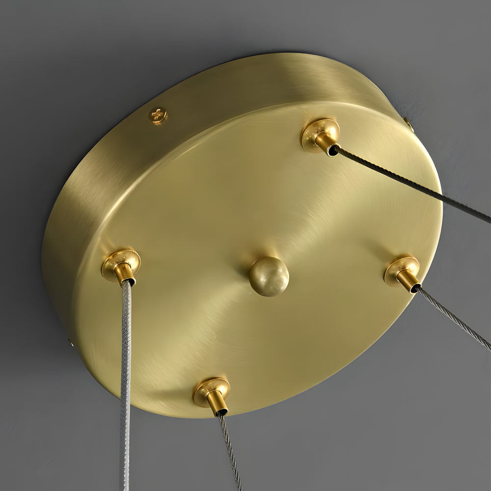 Luxury ring chandelier light with a close up of the crystal and gold ring details.