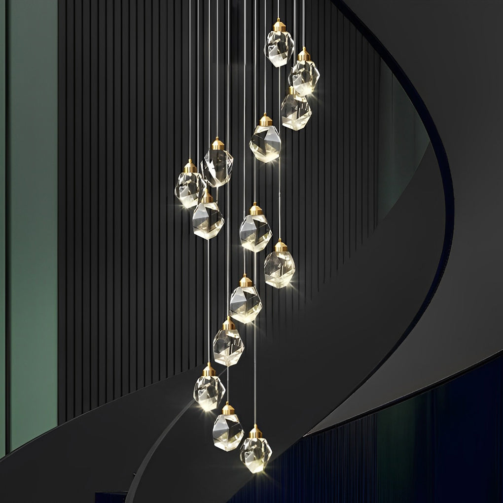 Luxury staircase chandelier with gold and crystal details, providing a stunning focal point.