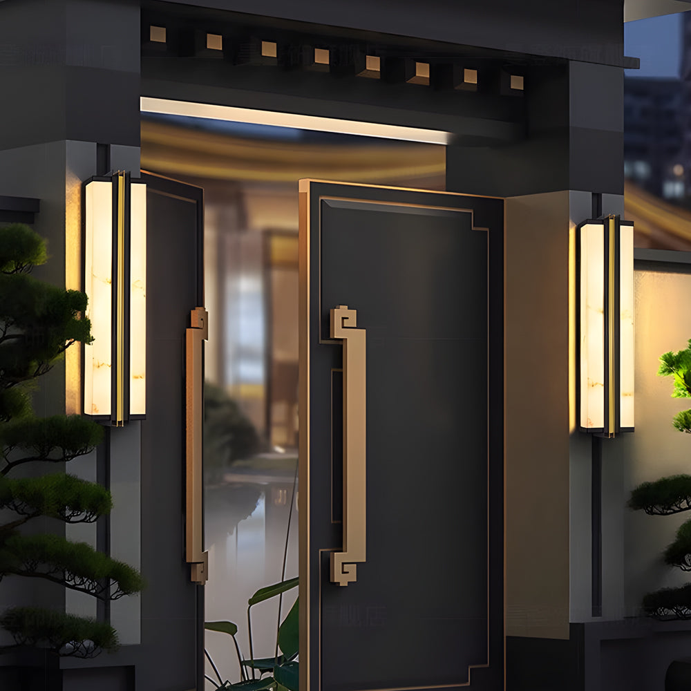 Luxury vertical wall light installed next to modern doorway with soft ambient lighting.