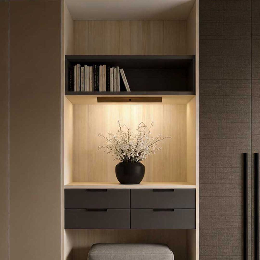 Magnetic motion sensor light enhancing a contemporary wardrobe with decorative items.