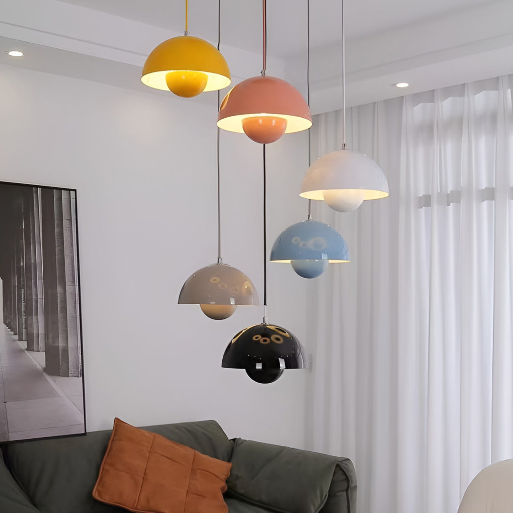 Metal dome pendant light in pink and gray, enhancing modern bedroom with soft lighting.