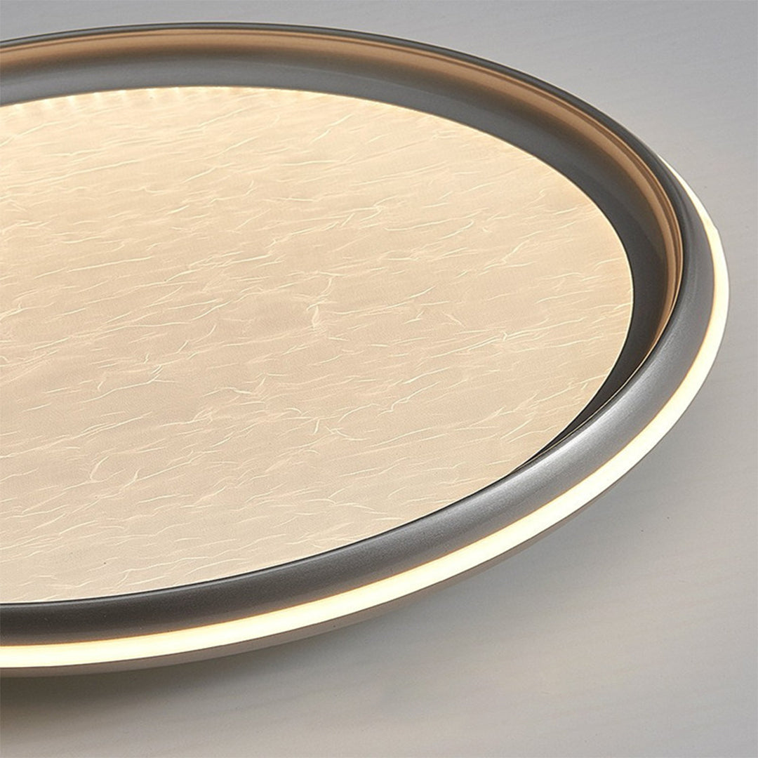 Metal flush mount light with silver finish and white acrylic shade offers sleek, modern ceiling illumination for bedrooms, hallways, and living spaces.