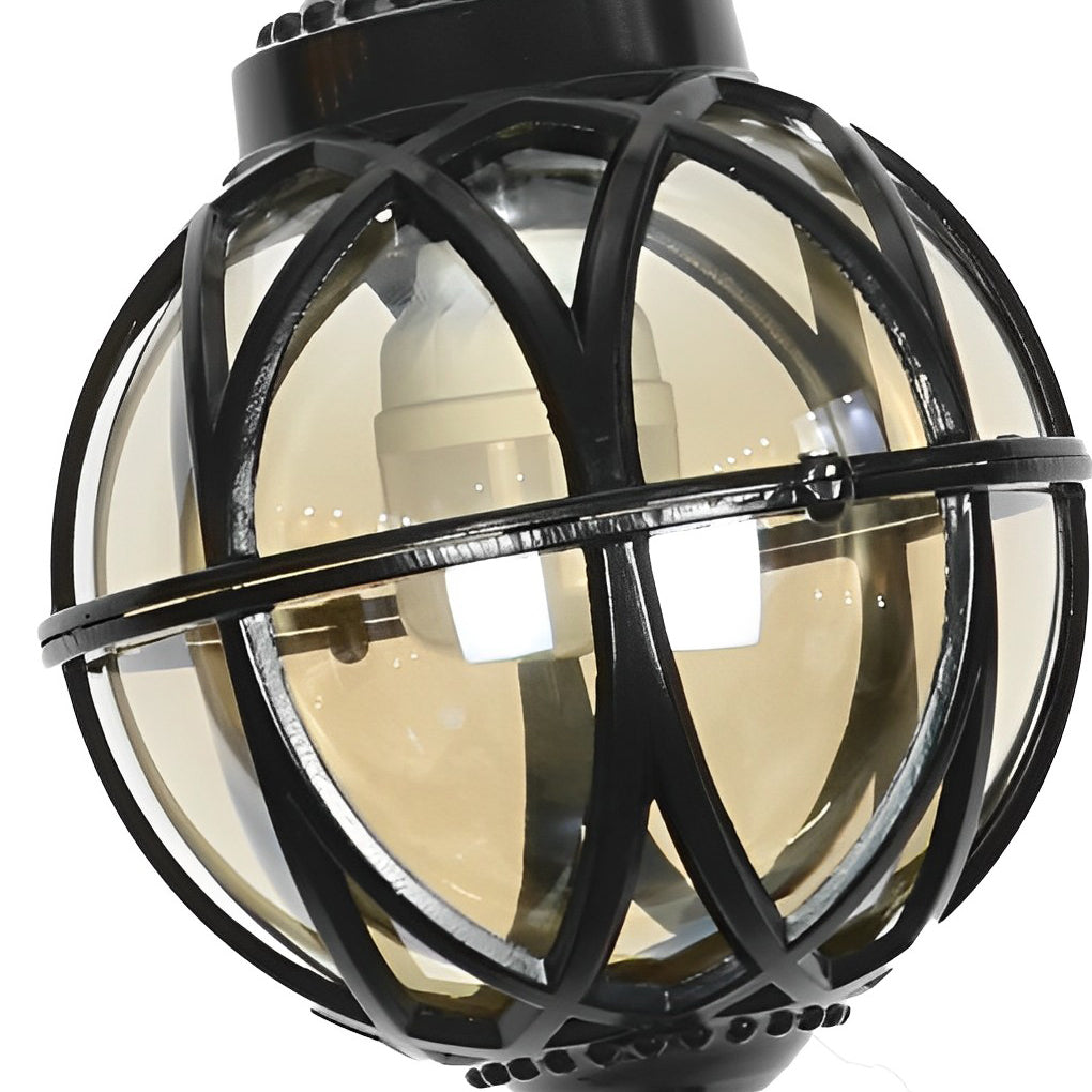 Product close up of a metal orb pendant light showing the curved metal frame and inner glass globe.