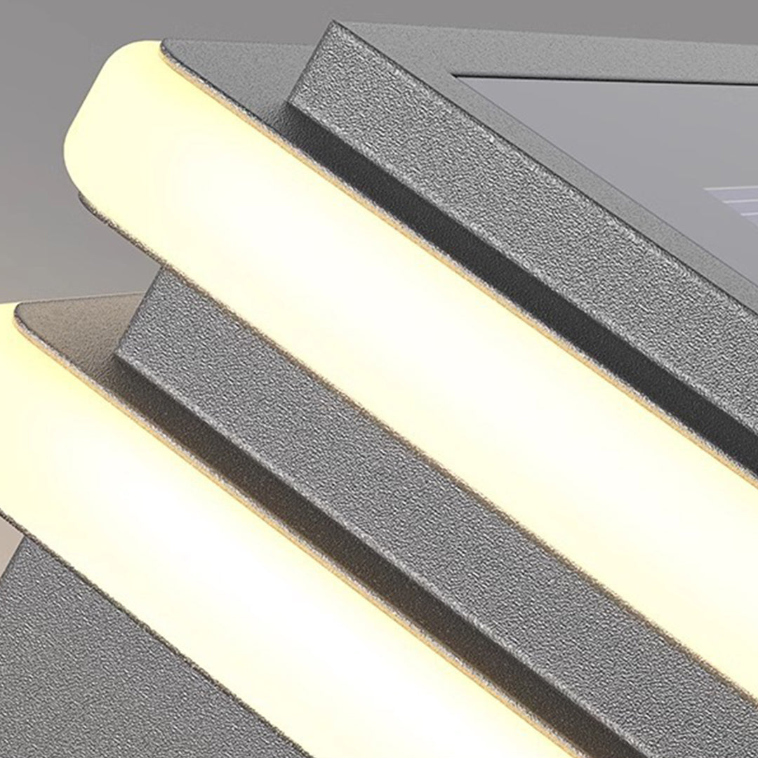 Metal pillar lights in a modern courtyard, providing functional and stylish illumination.