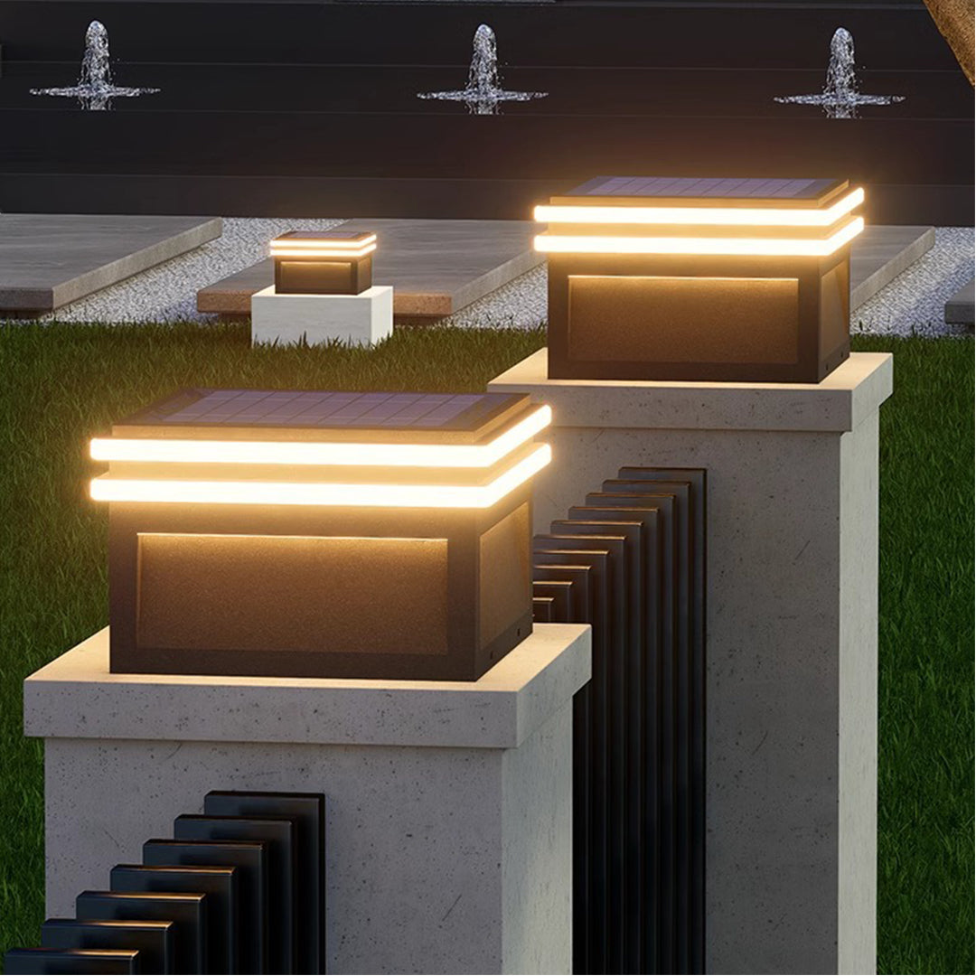 Metal pillar lights installed on stacked stone pillars, enhancing the outdoor staircase ambiance.
