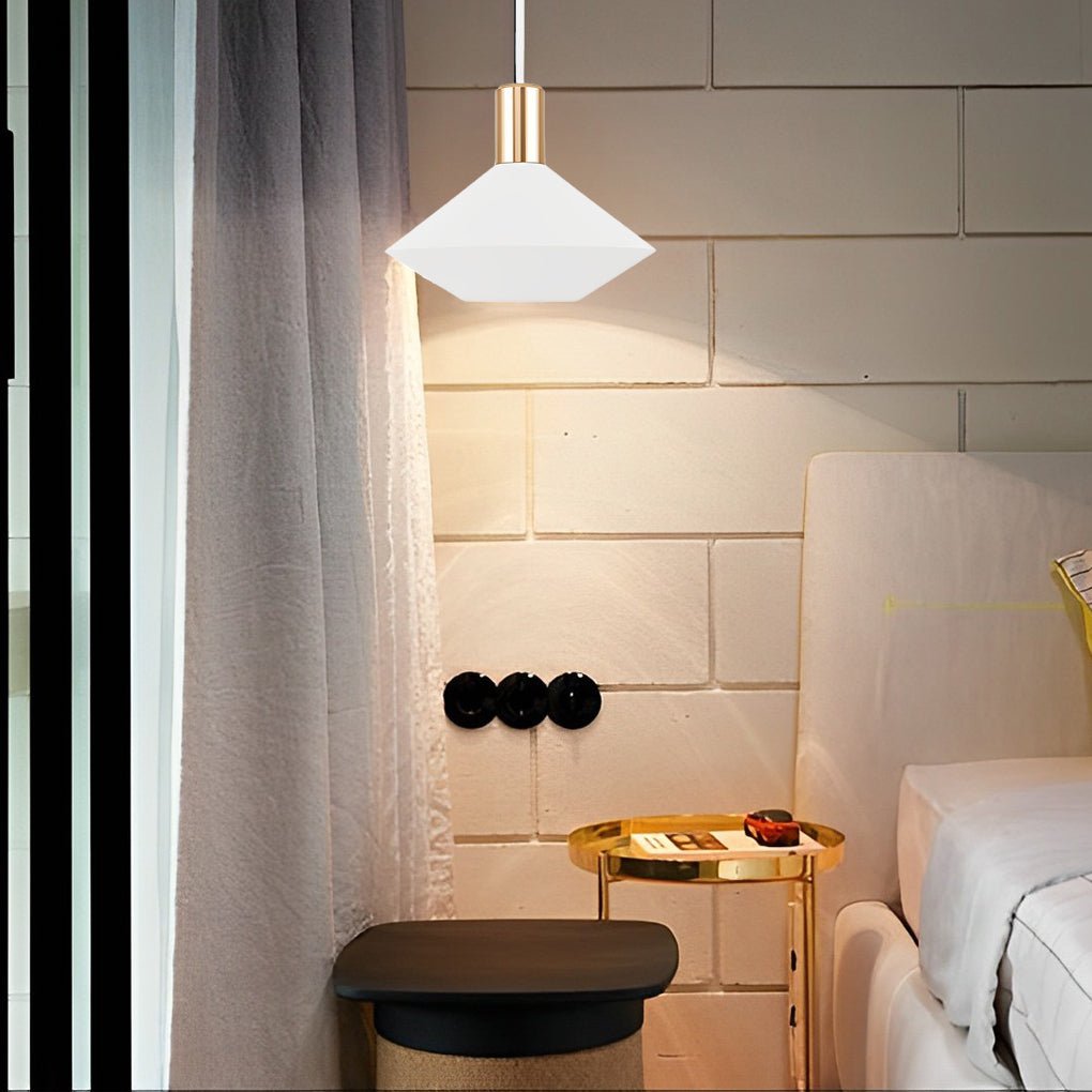 Mini hanging pendant lights illuminating a bedside table, combining functional task lighting with minimalist modern design.