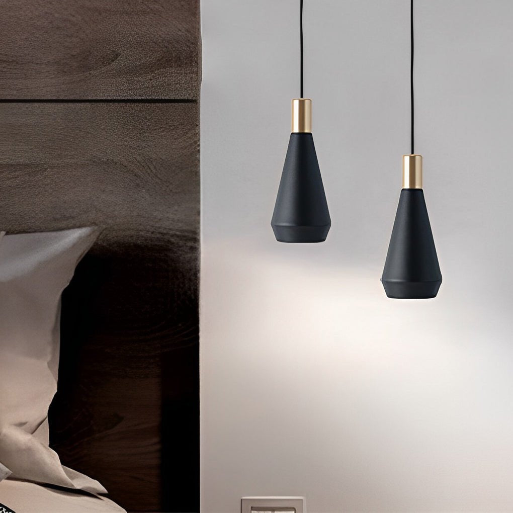 Mini hanging pendant lights mounted in pairs beside a bed, offering balanced and stylish lighting for a modern bedroom wall.