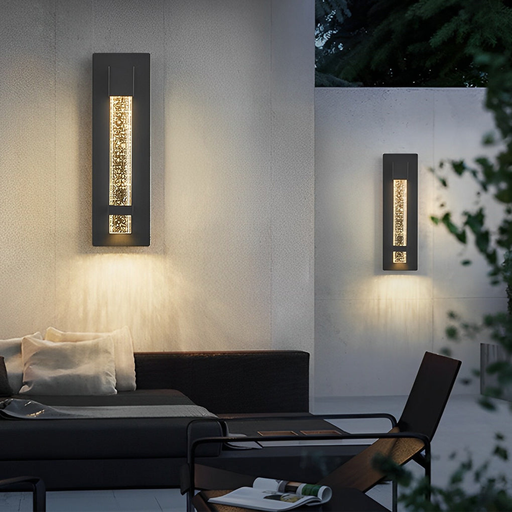 Minimalist bubble wall sconce illuminating outdoor lounge wall, producing elegant light diffusion through bubble glass.