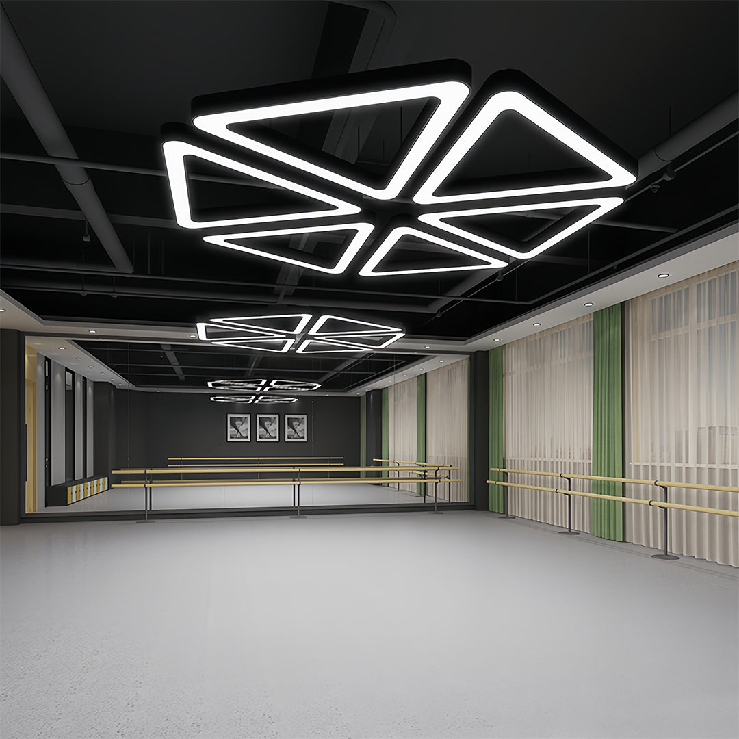Black modern chandelier with a minimalist, geometric style, providing ambient lighting for a stylish environment.