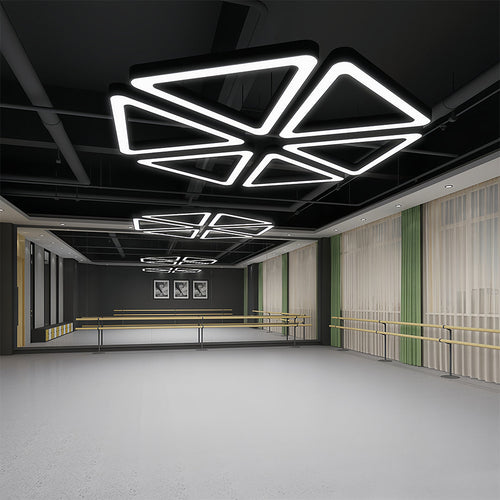 Black modern chandelier with a minimalist, geometric style, providing ambient lighting for a stylish environment.