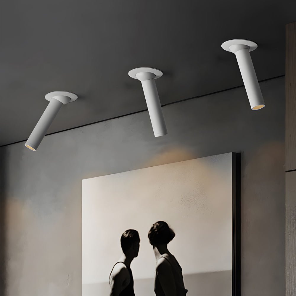 Minimalist LED surface spotlights in a modern bedroom, providing targeted illumination with a clean, unobtrusive design.