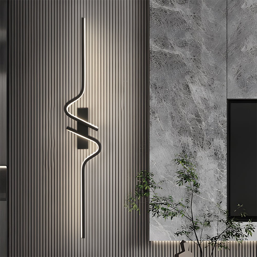Modern black curved wall sconce featuring clean, sleek lines that add elegance and a dramatic lighting effect.