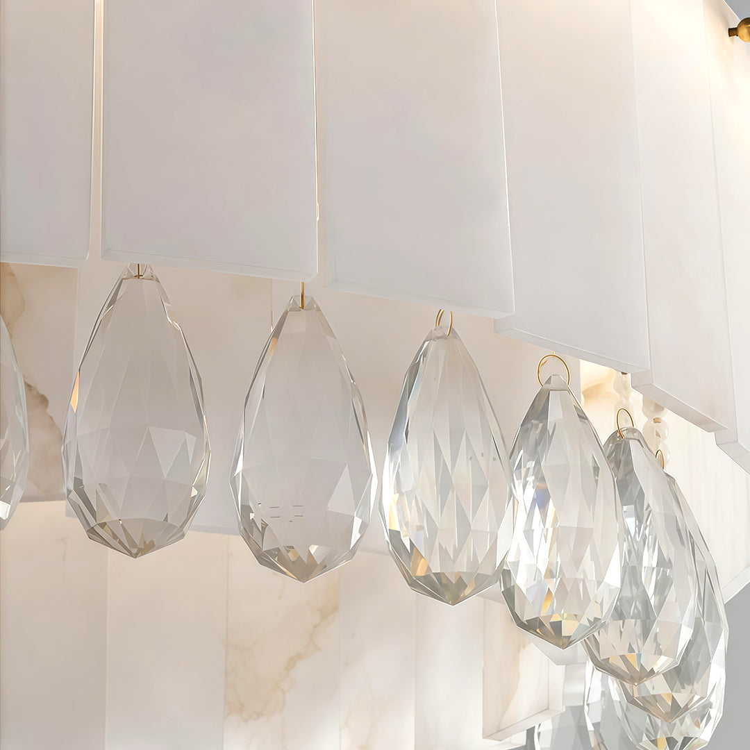This modern brass chandelier with alabaster stone drum shade combines elegance and warmth, perfect for enhancing dining rooms and living areas with refined lighting.